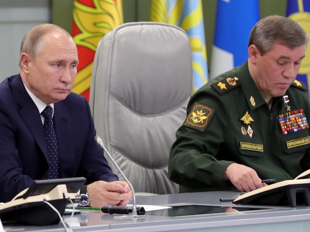 Russian President Vladimir Putin, left, and Chief of General Staff of Russia Valery Gerasimov oversee the test launch of the Avangard hypersonic glide vehicle. Picture: Sputnik/AP