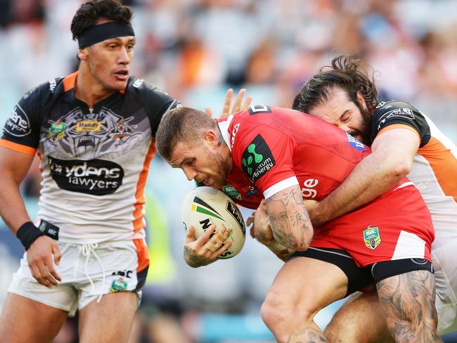 SYDNEY, AUSTRALIA - APRIL 02:  Josh Dugan of the Dragons is tackled by Aaron Woods of the Tigers during the round five NRL match between the Wests Tigers and the St George Illawarra Dragons at ANZ Stadium on April 2, 2017 in Sydney, Australia.  (Photo by Matt King/Getty Images)