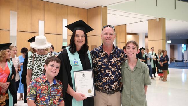 Breane Milligan with her family. Ms Milligan graduated with a Bachelor of Nursing. Picture: Elodie Jakes