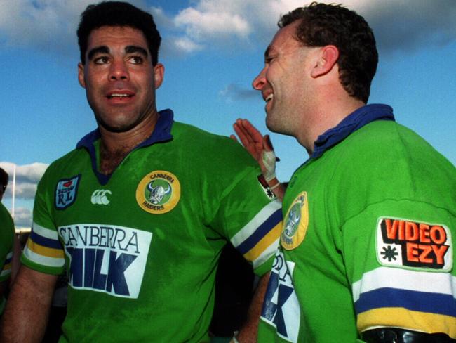 Captain Mal Meninga (L) is congratualted by teammate Ricky Stuart after his final match for the club following Canberra Raiders v Western Suburbs Winfield Cup game at Bruce Stadium in Canberra, 21/08/1994.