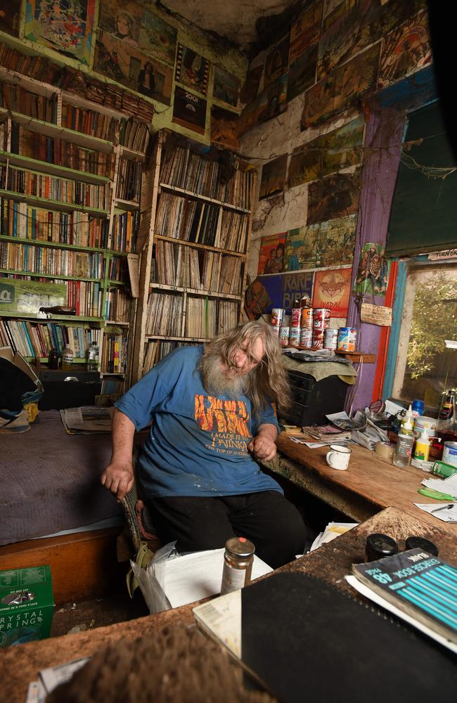 Mr Wells with part of his collection which takes up the house. Picture: Naomi Jellicoe