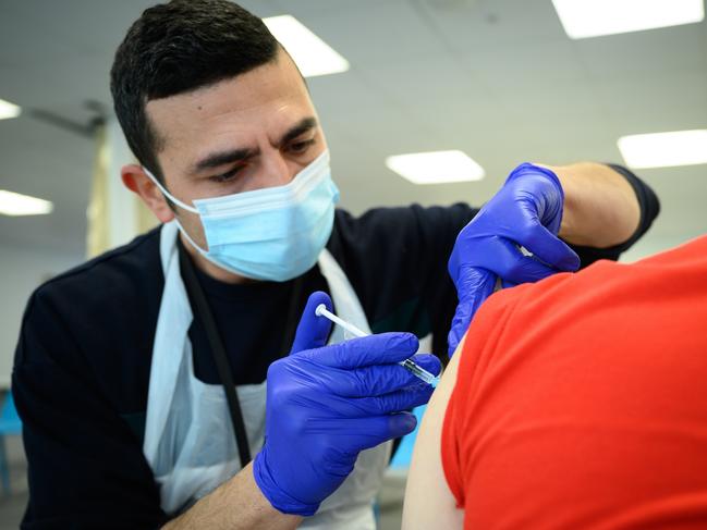 A medical worker administers a Covid booster shot to a man at a London clinic. Picture: Getty Images