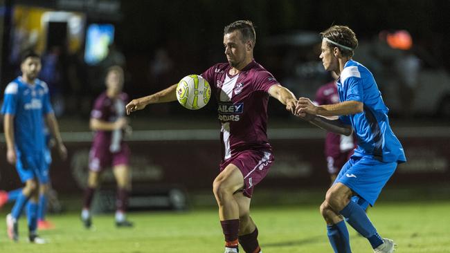 UNDER PRESSURE: Logan Lightning’s James Bonomi (left) holds off South West Queensland Thunder Wade Hall during the FQPL grand final. Picture: Kevin Farmer