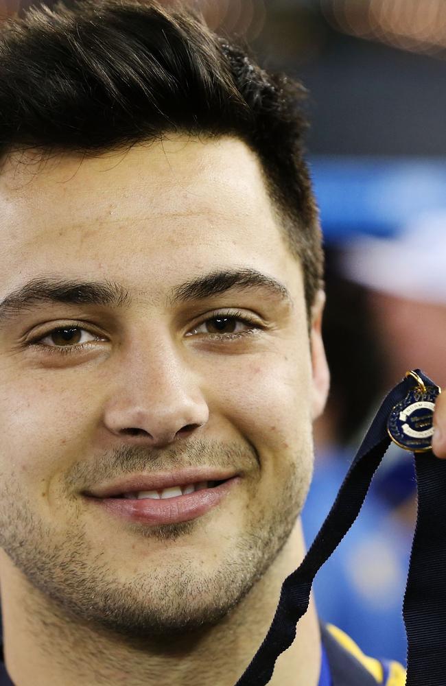 Michael Gibbons with one of his many awards — the Norm Goss Medal as best-afield in the 2015 VFL grand final.