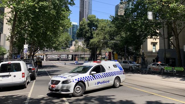 Police block off the intersection of Flinders and William streets. Picture: Brianna Travers