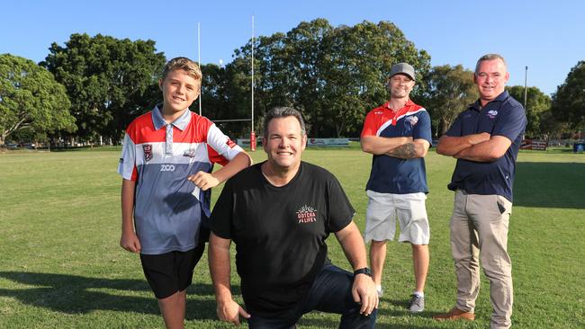 Runaway Bay junior Jay Robinson, 12, with Gus Worland, Junior President Nathan Wydmuch and committee member Peter Smith. PIC TIM MARSDEN