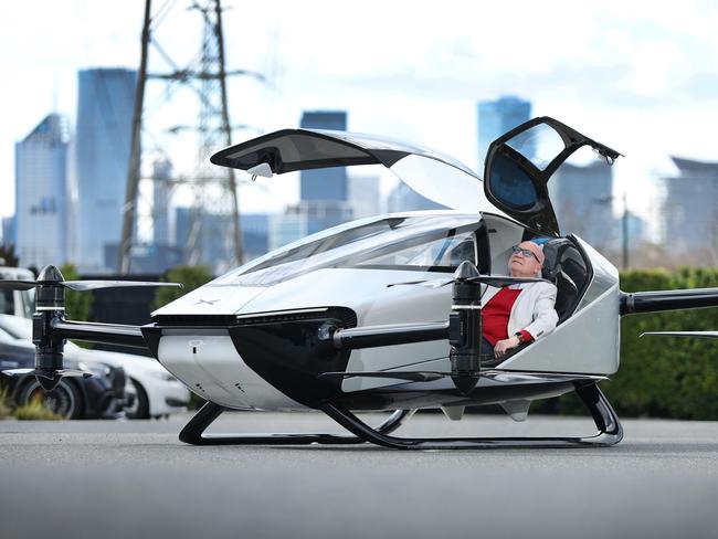 Electric flying car prototype, thought to be the first of its kind to hit Australia. The Xpeng X2 is a pilotless remotely flown two seated car. Ray Evans CEO of Future Drive Autoshows sits in the Xpeng X2 dreaming of a day soon like the Jetsons.                     Picture: David Caird