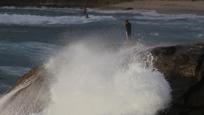 Experienced rock fisherman Colin Freeman of Waverly fishes in a safe postion at Bronte early today .pic John Grainger