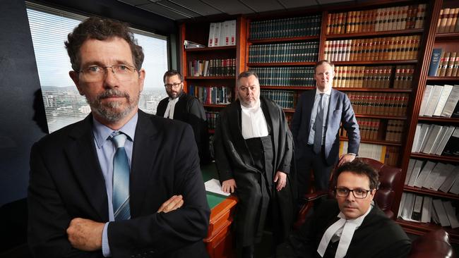 Former JCU climate scientist Peter Ridd preparing with his legal team barrister Benjamin Kidston, QC Stuart Wood, lawyer Mitchell Downes, barrister Benjamin Jellis, on last day of a Federal Court hearing, John Jarrard Chambers, Brisbane. Mr Ridd claims he was unfairly dismissed from his job with the university for publicly voicing his opinions on climate change and coral bleaching which contradicted his colleaguesÕ research. Photographer: Liam Kidston. NO BYLINE.