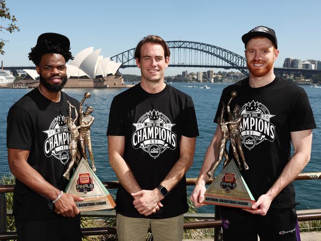 Buford with the iconic Sydney Opera House as a backdrop, celebrates the Kings’ back-to-back titles with players Derrick Walton Jr and Angus Glover. Picture: Getty Images