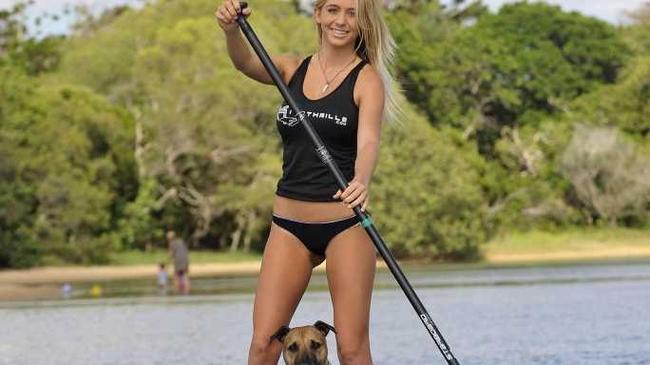 This Saturday, March 26 will be the Currimundi SUP Festival. Promoting the festival is 19 year old Jy-Leigh Wilson of Currimundi with Prada Lilly the 4 year old Staffy cross Bull terrier. Photo Greg Miller / Sunshine Coast Daily. Picture: Greg Miller