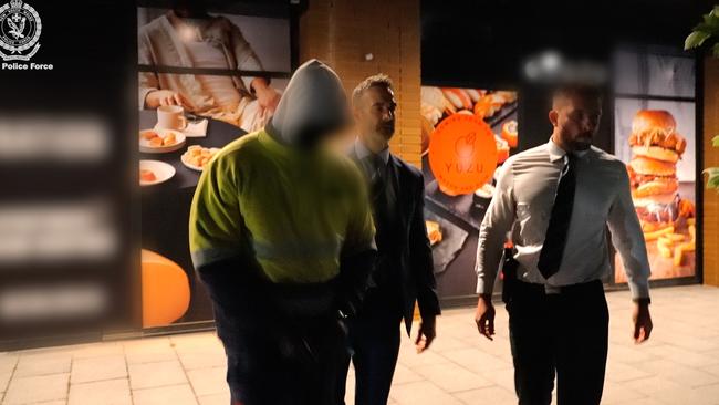 Homicide Squad detectives arrest Bil Ater Benjament on Friday. Picture: NSW Police