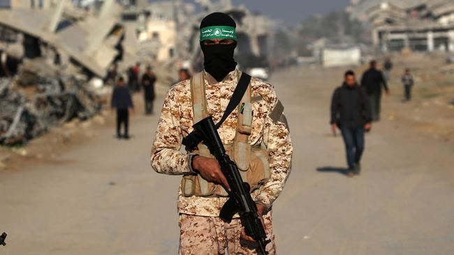 Palestinian Hamas fighters stand guard in Khan Yunis on January 30, 2025, as part of their third hostage-prisoner exchange. Picture: AFP