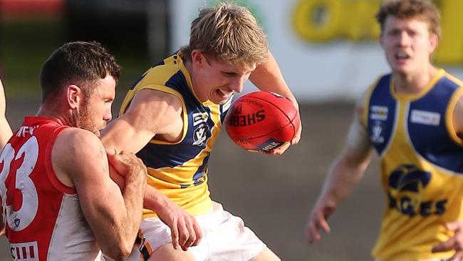 North Warrnambool Eagles player Harry Keast tries to evade a tackle from a South Warrnambool player. Picture Yuri Kouzmin