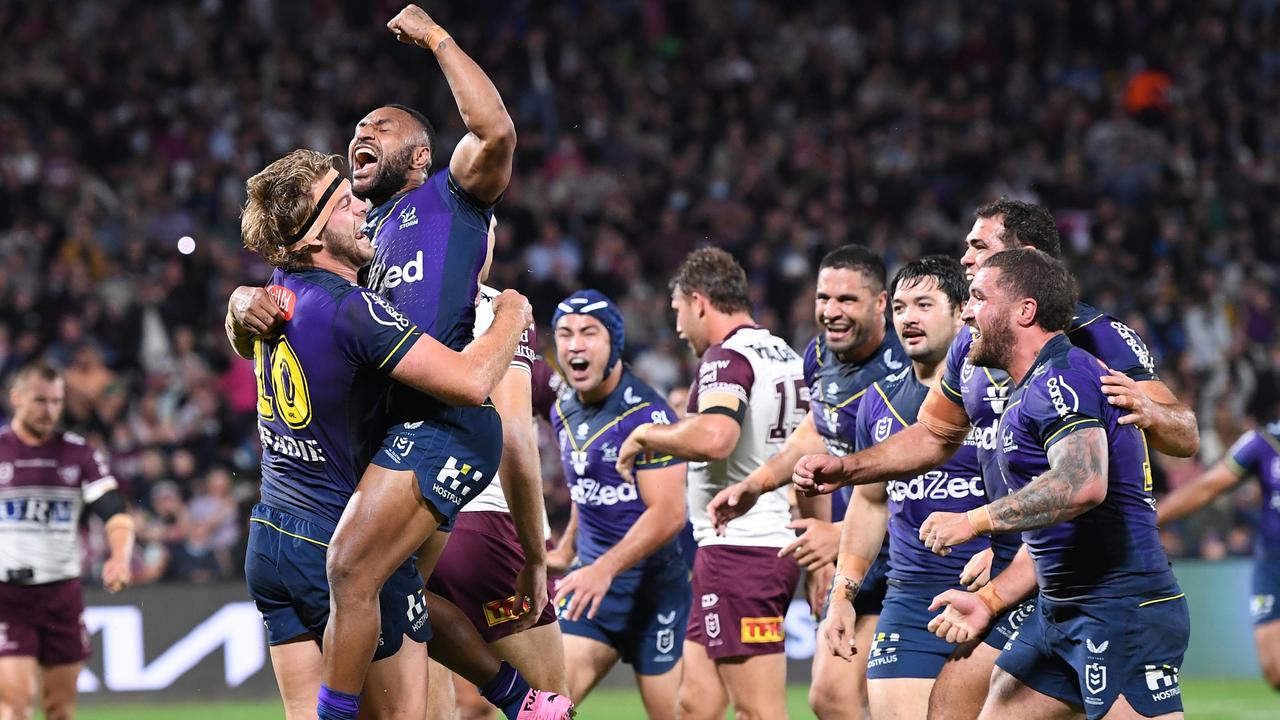 Christian Welch celebrates with Justin Olam after scoring a try against Manly. Picture: Bradley Kanaris/Getty Images