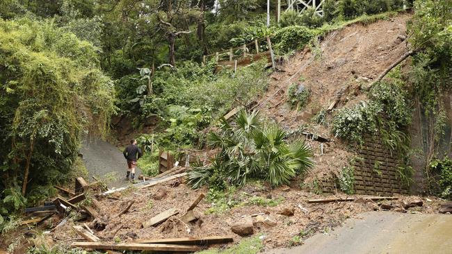 Dave Parker assesses the damage to the frontyard of his home on Nareen Pde in Narrabeen. Picture: Tim Hunter.