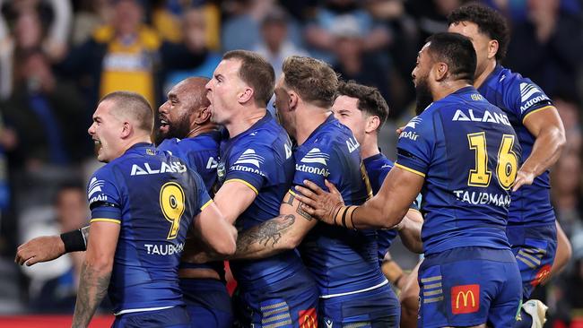 SYDNEY, AUSTRALIA - MAY 30:  Junior Paulo of the Eels celebrates with team mates after scoring a try during the round 13 NRL match between Parramatta Eels and Cronulla Sharks at CommBank Stadium on May 30, 2024, in Sydney, Australia. (Photo by Cameron Spencer/Getty Images)