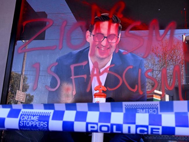 The slogan "Zionism is Fascism" is sprayed on the electoral office of Australian federal Labor Party member of parliament Josh Burns in the Melbourne suburb of St Kilda after police said at least five people smashed windows and painted slogans on the walls on June 19, 2024. It is the latest in a string of acts of vandalism targeting the offices of state and federal MPs in the wake of the conflict in Gaza. (Photo by William WEST / AFP)