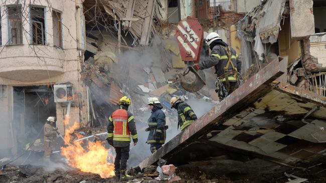 Firemen work to clear rubble in Kharkiv. Picture: Sergey Bobok/AFP