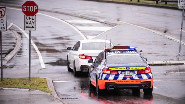 Police pay close attention to a motorist at the intersection of Franklin St and Anzac Pde. Picture: Flavio Brancaleone