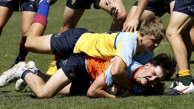 Henry Gardiner from U15 Waugh team tackles Toby Davies from U15 Gavin side at the Next Gen Cup. Pictures: John Appleyard