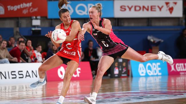 Maddy Proud of the Swifts and Hannah Petty of the Thunderbirds compete for the ball during the round 14 Super Netball match in Sydney. Picture: Jason McCawley