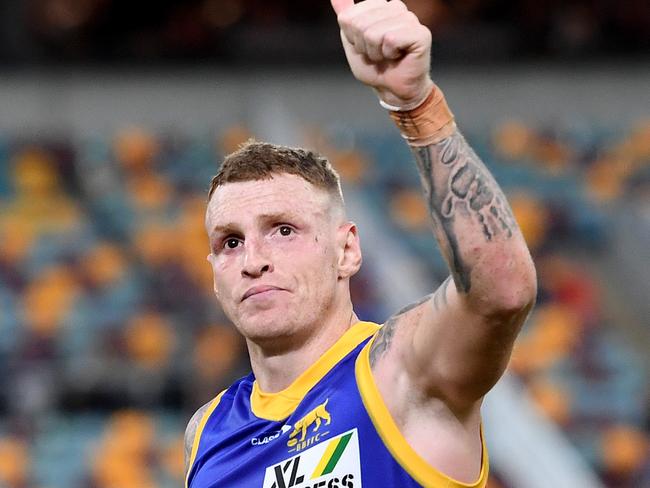 BRISBANE, AUSTRALIA - MAY 29: Mitch Robinson of the Lions celebrates victory after the round 11 AFL match between the Brisbane Lions and the Greater Western Sydney Giants at The Gabba on May 29, 2021 in Brisbane, Australia. (Photo by Bradley Kanaris/Getty Images)