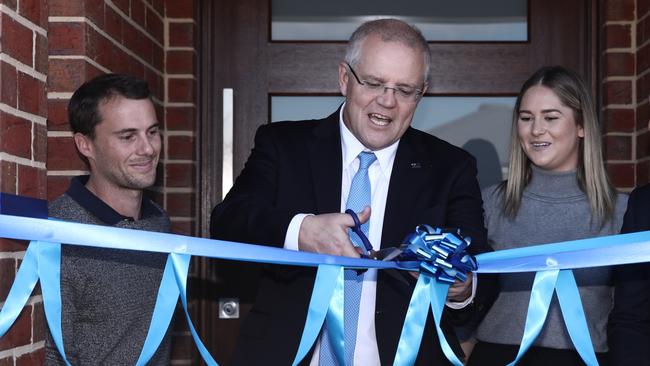 Prime Minister Scott Morrison and first homeowners Andy and Caitlin at their new digs in Wangaratta, Victoria. Picture: AAP