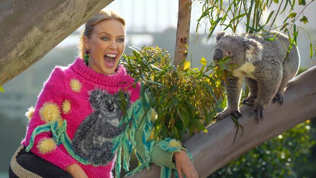 Kylie Minogue meets a koala at Uluru in the Northern Territory. Pic: Tourism Australia