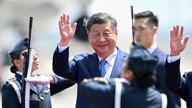 China's President Xi Jinping waves upon his arrival for the APEC Summit. Picture: Ernesto Benavides / AFP