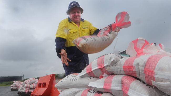 Gold Coast city Council maintenance worker Geoff Toole keeping the sandbag pile topped up at the Bilinga sandbag depot. Picture Glenn Hampson