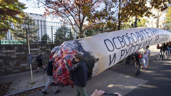 Cannabis advocates carry a fake inflatable joint outside the Russian Embassy to demand the release of American basketball star Brittney Grine. Picture: Drew Angerer/Getty Images/AFP