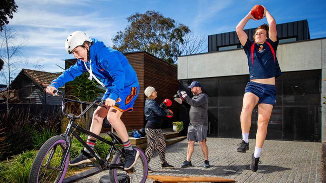 Shannon Davis with partner Mark and kids Arki, 12, and Jett, 14. Picture: Mark Stewart