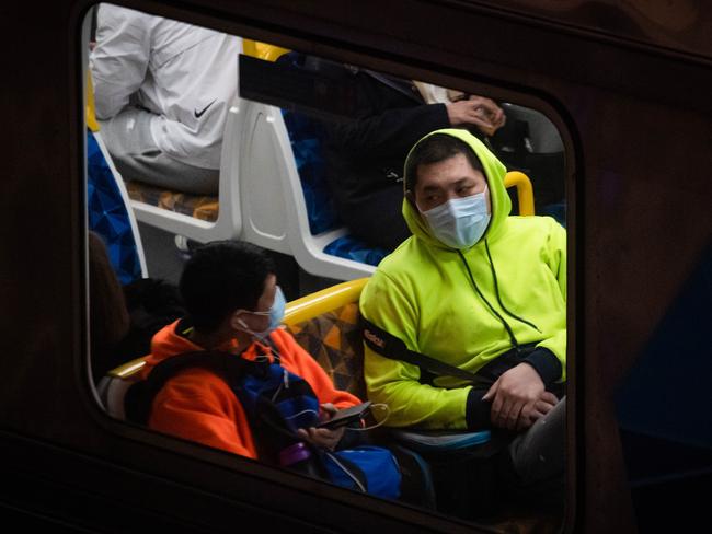 Passengers wear surgical masks to stay safe against Covid-19 on trains and at stations in Melbourne. Flinders Street station pictured. Picture: Jason Edwards