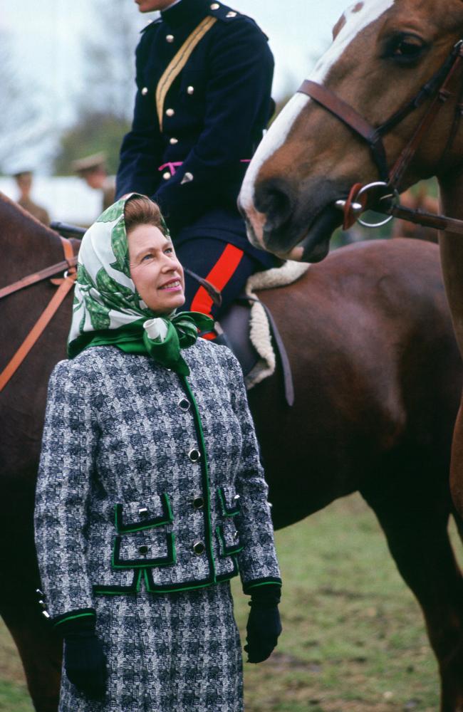 Queen Elizabeth II loved horses. She is pictured here talking to riders at the Windsor Horse Show in the 1970s or early 1980s. Picture: Getty Images