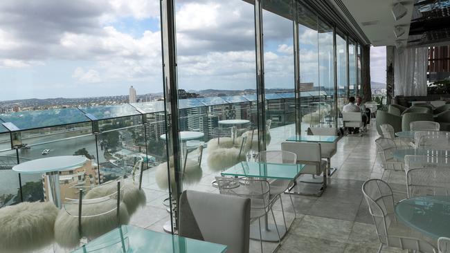 The outdoor area’s tall bar tables are matched with stools covered with white, shaggy faux fur outdoor area.