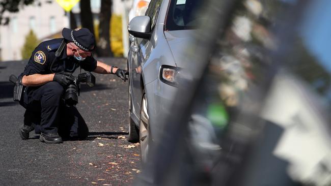 Tasmanian Police investigate numerous cars that had their tyres slashed on Pine Street, West Hobart overnight. Pine Street. Picture: Zak Simmonds