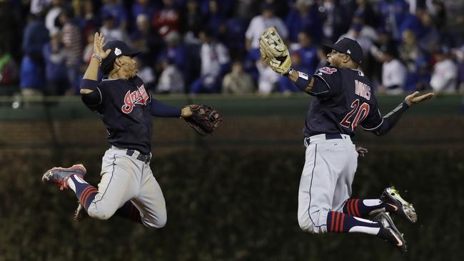 Cleveland Indians' Francisco Lindor and Rajai Davis celebrate after Game 4.