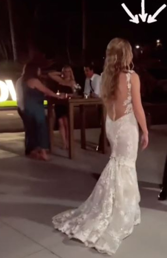 The real bride’s dress was very similar to the one worn by a wife of her new husband’s colleague. Picture: TikTok/Cari Izaguirre