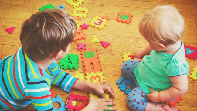 kids playing with puzzle, early child development