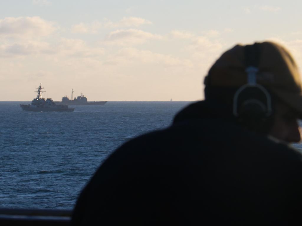 US Navy, Seaman Rafael Mendez stands watch aboard the dock landing ship USS Carter Hall. Picture: AFP