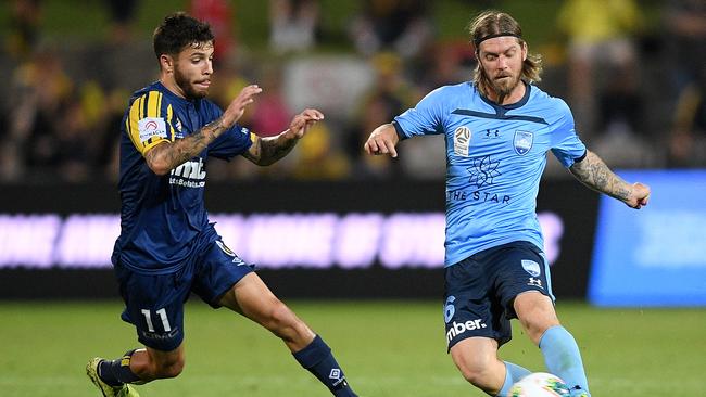 Former Roar star Luke Brattan (right) may be a chance to return to Brisbane next season. Picture: AAP