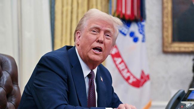 US President Donald Trump speaks to the media after signing executive orders in the Oval Office of the White House in Washington on January 23. Picture: Roberto Schmidt/AFP