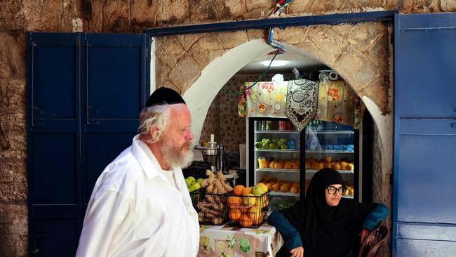 Everyone is waiting but life continues in the Old City of Jerusalem this week. Picture: Hazem Bader / AFP