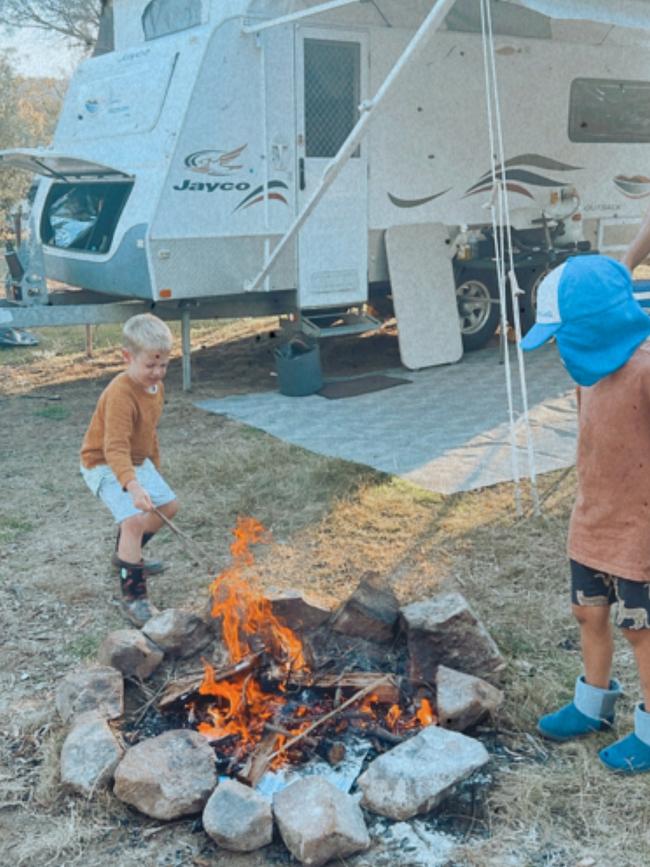 Patrick and Hamish Murrell by the campfire. Picture: Natalie Murrell @gone_caravanning_tas