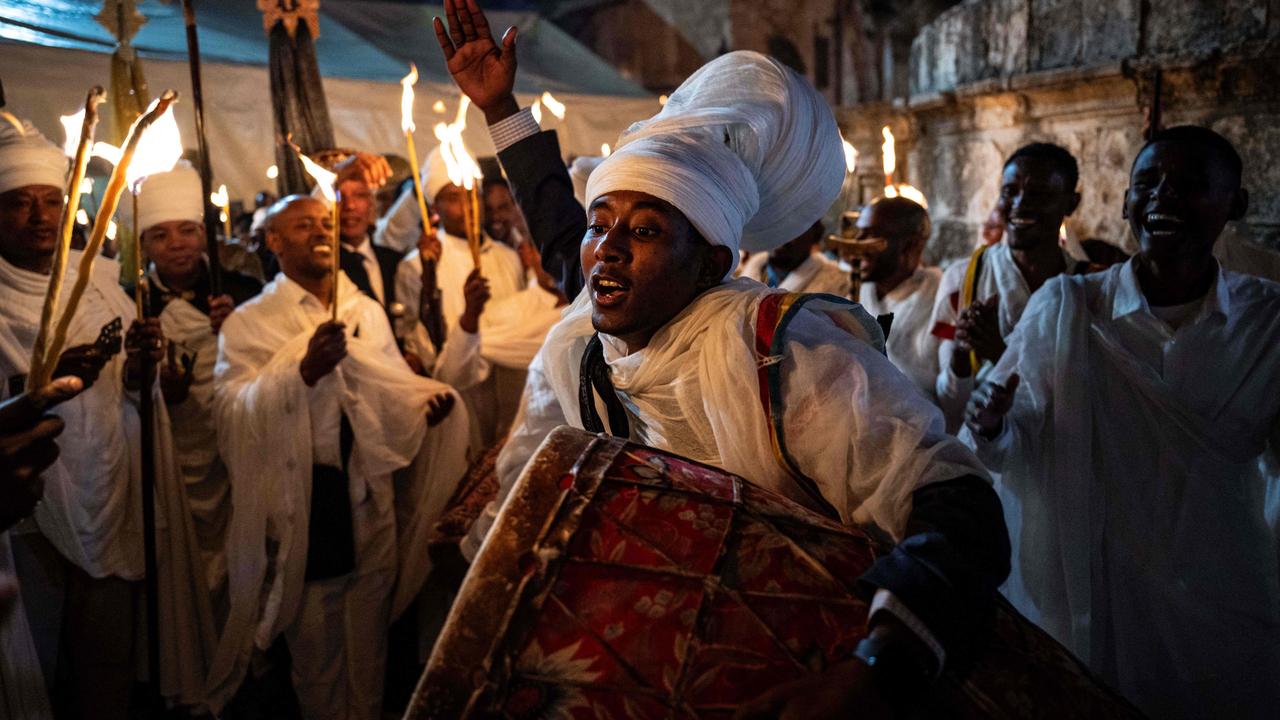 Ethiopian Orthodox Christians gather with candles during the Holy Fire ceremony at the Deir Al-Sultan Monastery in Jerusalem's Old City. Picture: Ronaldo Schemidt/AFP