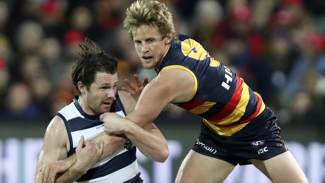 Patrick Dangerfield and Rory Sloane collide. Picture SARAH REED