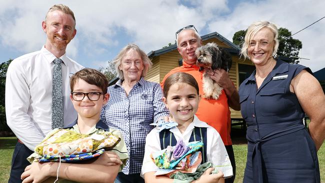 The annual Freshwater Fair is back bigger and better this year, expanding from the Freshwater Tennis Club to include Richmond Park and the Queensland Country Women's Association Hall. Freshwater Christian College principal Matt Scott, Grade 3 student Callon Bryant, Grade 4 student Aria Garvellotto and head of junior school Jane Greenlees with organisers Sue Tons from the QCWA Freshwater branch and Kane Brown, pictured with his dog Lyla. Picture: Brendan Radke