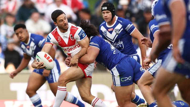 Ben Hunt fends off the Bulldogs. Photo by Matt King/Getty Images.