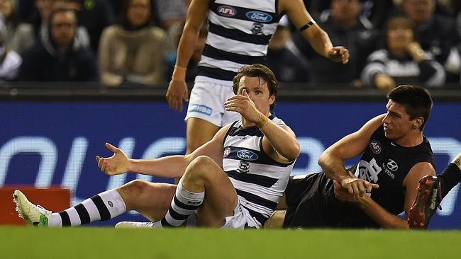 Patrick Dangerfield appeals to the umpire after his dangerous tackle on Matthew Kreuzer.